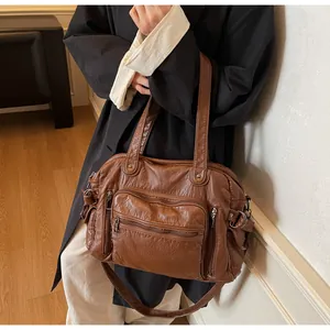 Detailed view of vintage brown PU leather tote bag with multiple pockets for women