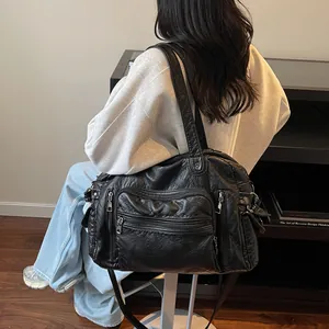 Fashionable black vintage PU leather tote bag with multiple pockets for women's commuting