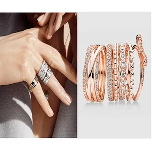 Colección de anillos de oro rosa con diseños de corazón y lazo y piedras pavé