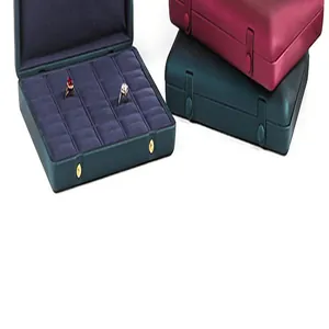 Close-up of multi-slot velvet interior and satin exterior of jewelry storage boxes