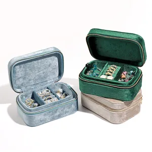 Detailed interior view showing compartments and velvet texture of jewelry boxes