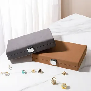 Elegant velvet double-layer jewelry storage box with secure lock in gray and tan colors