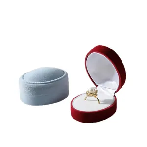 Portable oval velvet ring boxes in blue and red with soft flocking texture for jewelry