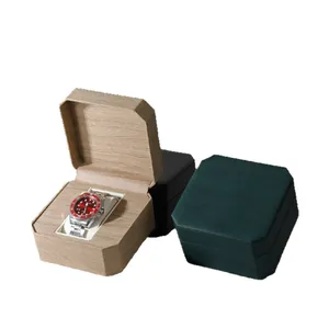 Vintage octagonal watch display boxes in wood grain, black, and green finishes.