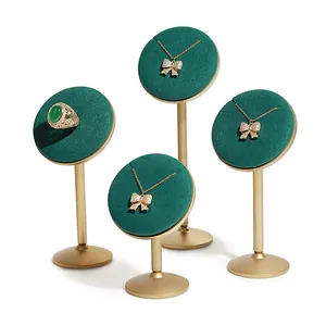 Set of 4 emerald green velvet jewelry display stands with elegant gold metal bases