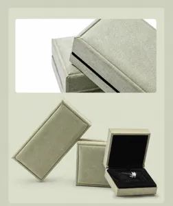 Close-up of sage green suede jewelry box showing superfiber edging and removable lining