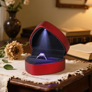 Red heart-shaped LED jewelry box with lacquer finish for ring and pendant presentation