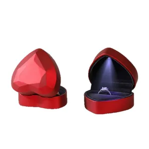 Elegant heart-shaped LED ring box with red lacquer finish and light for engagement