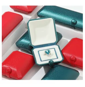 Premium emerald and red vintage jewelry boxes with elegant button clasps shown in detail