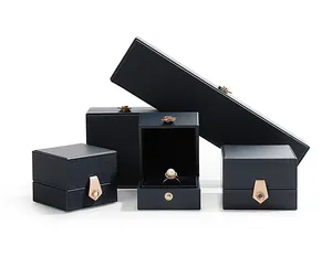 Collection of premium navy blue PU leather jewelry boxes with rose gold snap closures