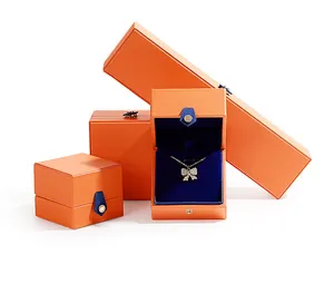 Premium orange PU leather jewelry box set featuring a luxurious blue velvet lining