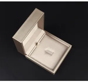 Detailed view of the luxury champagne PU leather brooch box with soft interior lining