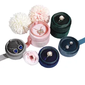 Elegant cylindrical velvet jewelry boxes for rings and necklaces in various colors