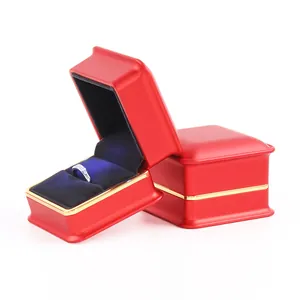 Premium red jewelry box with built-in LED light and black velvet ring holder insert