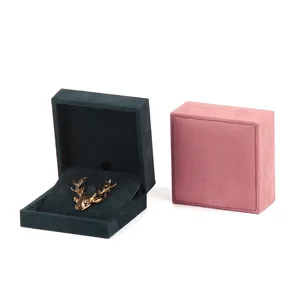 Premium PU leather brooch storage boxes in pink and dark teal for medals and pins.