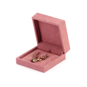 Luxury pink velvet brooch box for jewelry packaging and badge storage display.