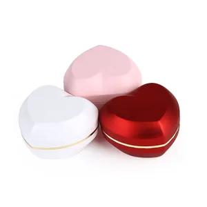 Elegant heart-shaped LED ring boxes for proposals available in white, pink, and red colors.