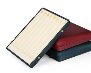 Detailed view of high-capacity jewelry display trays showing stacked boxes and interior hooks.