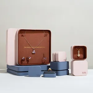 Premium PU leather jewelry packaging boxes for necklaces and rings in soft pastel tones.