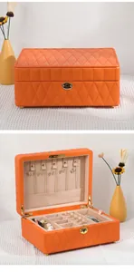 Elegant orange quilted leather jewelry box showing open and closed storage details