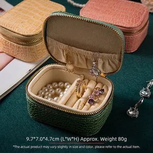 Detailed view of crocodile texture jewelry box with internal storage compartments