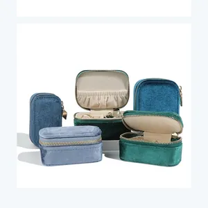 Portable velvet jewelry travel organizer for rings, necklaces, and earrings storage.
