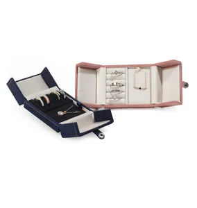 Open luxury jewelry box set in blue and pink for ring and necklace storage display