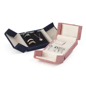 Luxurious double-opening velvet jewelry boxes for rings and necklaces in blue and pink.