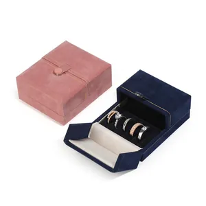 Luxury gold trim jewelry boxes in pink and navy blue with ring slots