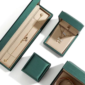 Écrins à bijoux haut de gamme en cuir PU brossé vert foncé pour bagues et bracelets.