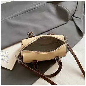 Close-up detail showing the interior lining and capacity of the matte Boston cylindrical bag