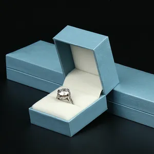 Boîte à bijoux en papier texturé bleu clair haut de gamme pour l'affichage de bagues
