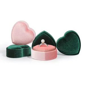Heart-shaped velvet jewelry ring boxes in pink and green for elegant gift packaging