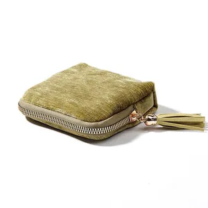 Elegant olive green velvet jewelry storage pouch with zipper and stylish tassel detail