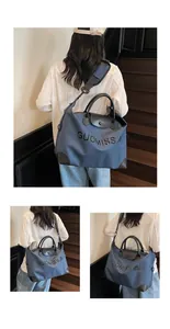Detailed shots of the blue large capacity travel bag featuring GUOMISSA lettering and leather straps
