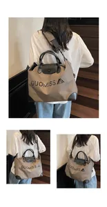 Khaki large capacity travel tote bag with GUOMISS print and black leather handles