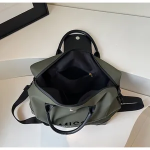 Macro view of internal compartment in green large capacity travel duffle bag