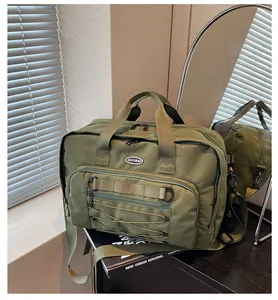 Close-up detail of olive green tactical travel bag featuring a multi-pocket functional design