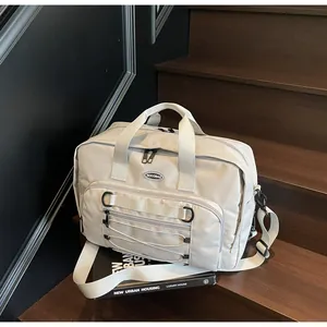 Large capacity beige techwear messenger bag with adjustable shoulder straps on stairs