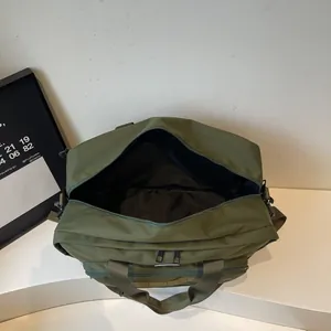 Large capacity olive green messenger bag with wide opening and multiple compartments