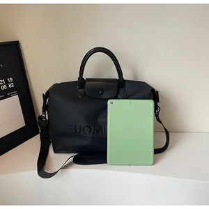 Large capacity black travel bag with iPad for size reference comparison