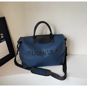 Navy blue large capacity travel duffel bag with GUOMISS print and shoulder strap