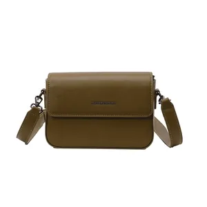 Detailed front view of a retro olive green textured simple square crossbody bag for women