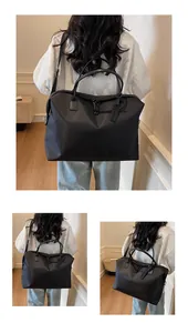 Detailed views of a black large capacity travel duffel bag carried by a female model.