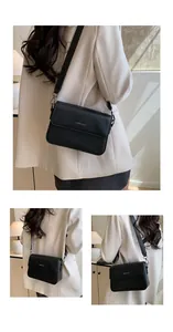 Detailed views of a black vintage minimalist square crossbody bag with a blazer.