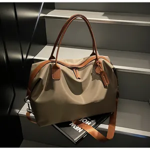 Large capacity khaki nylon business travel bag with brown handles and shoulder strap