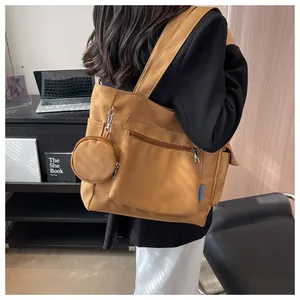 Large capacity brown canvas tote bag featuring front pocket and detachable round pouch