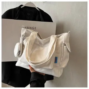 Minimalist white large capacity canvas tote bag with matching coin purse for commuting