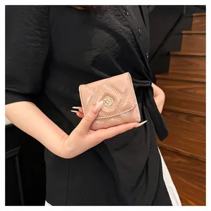 Elegant quilted leather mini wallet for women in nude pink with gold clover clasp