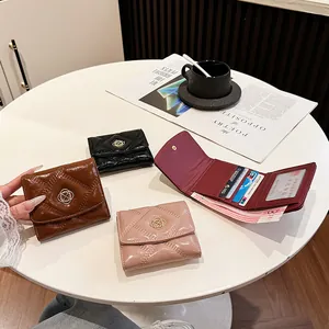 Elegant quilted leather short wallet for women featuring fold-over clasp and multiple colors